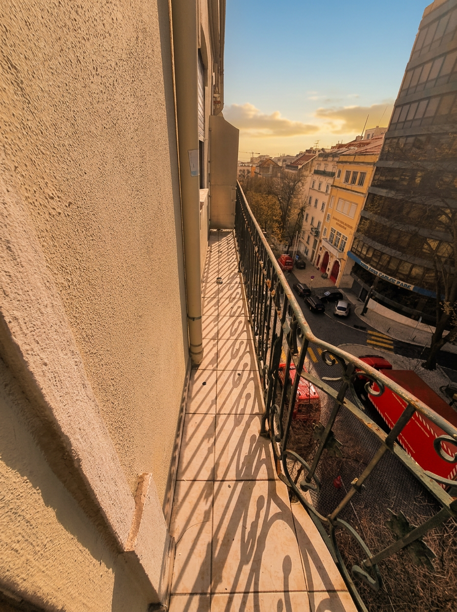 Long private balcony running along the facade in golden-hour light